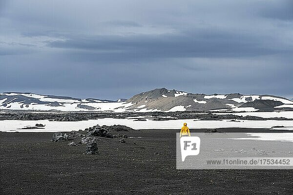 Hiking in the crater of the Askja volcano  snow-covered volcanic landscape  Iceland  Europe