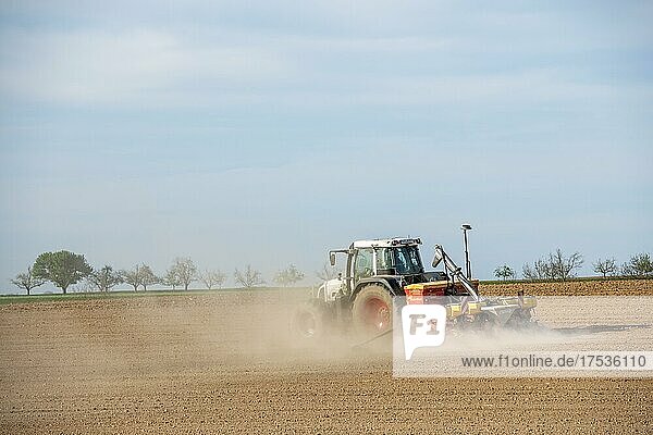 Tractor with seed drill in the field in spring  Baden-Württemberg  Germany  Europe