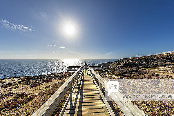 Australia  Victoria  Cape Bridgewater  Sun shining over boardwalk leading to Bridgewater Blowholes