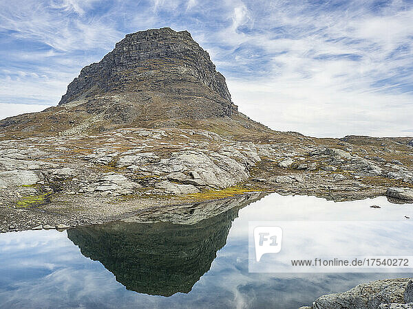 Harteigen mountain reflecting in shiny lake