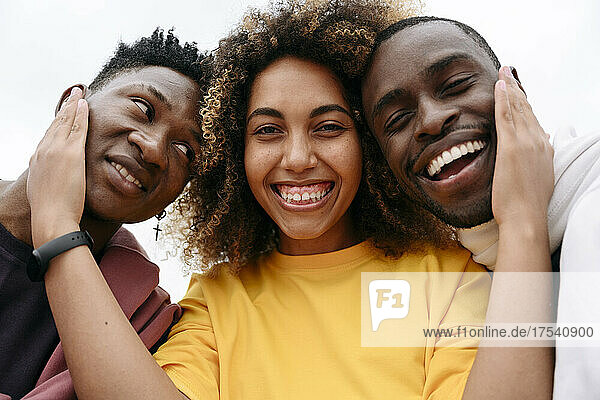 Smiling young woman with friends