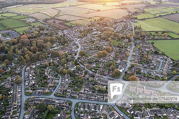 UK  England  Whittington  Aerial view of town at autumn dusk