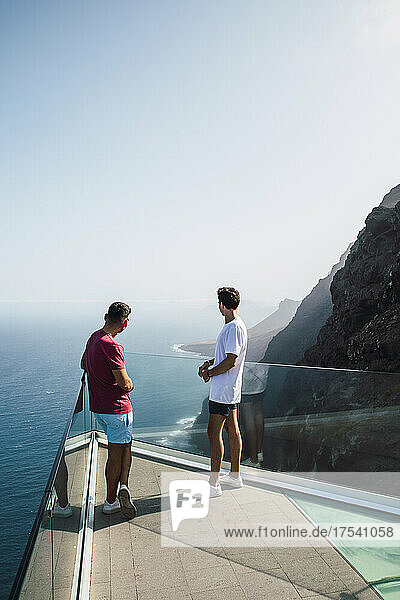 Young friends looking at sea from Mirador Del Balcon  Grand Canary  Canary Islands  Spain