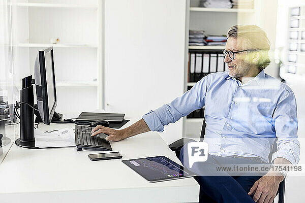 Businessman using computer at workplace