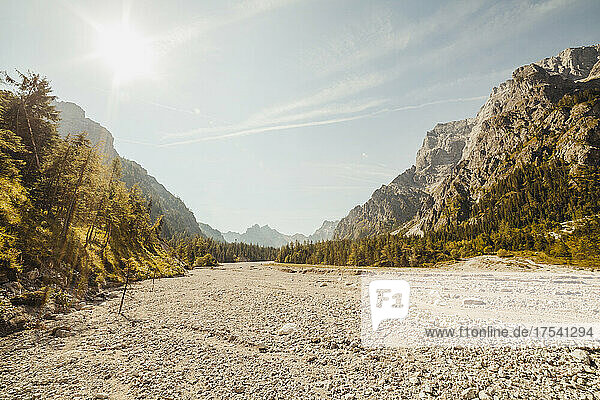 Sun shining over mountain valley