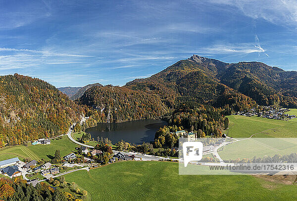 Austria  Salzburg  Winkl  Drone view of Krotensee lake and surrounding village in autumn