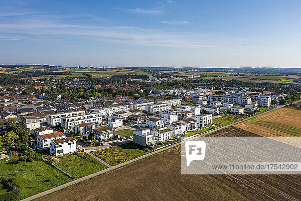 Germany  Baden-Wurttemberg  Sindelfingen  Aerial view of plowed field in front of new development area