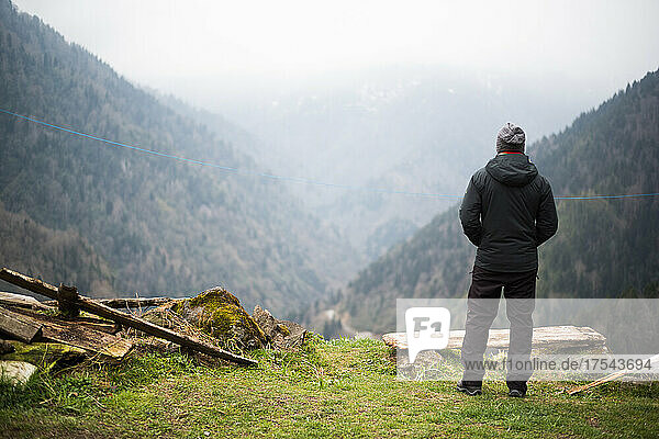 Turkey  Rear view of man standing in mountain landscape