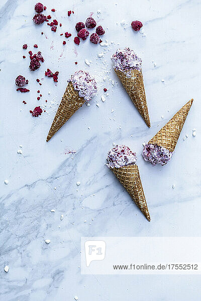 Raspberry and sour cream ice cream in cones