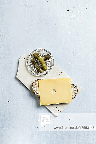 Grey bread with cheese slice  served with pickles