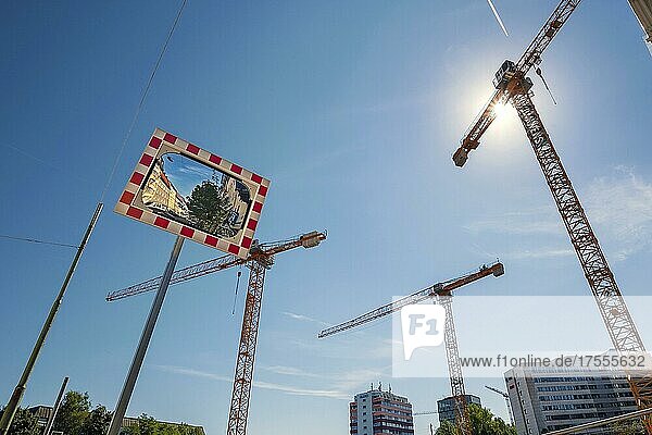 Cranes and concave mirrors at construction site on Orleanstr. Munich  Bavaria  Germany  Europe