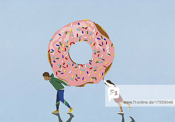 Junge und Mädchen tragen großen Donut mit Streuseln auf blauem Hintergrund