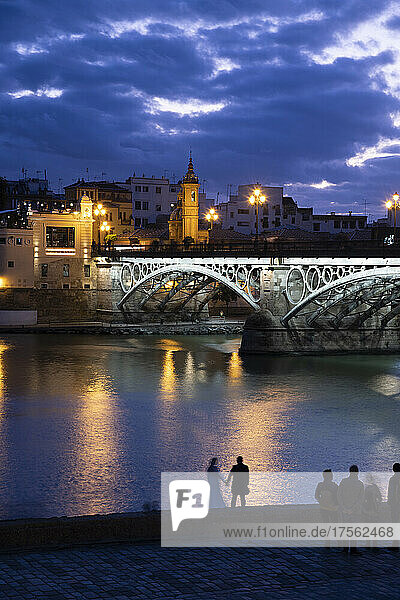 The Triana Bridge (Puente de Triana) (Puente de Isabelle II) in Seville at twilight  Seville  Andalucia  Spain  Europe