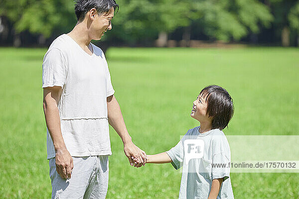 Japanese Parent And Child Holding Hands