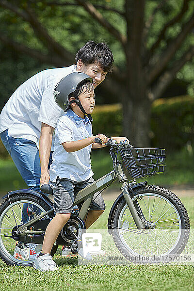 Japanese Boy Practicing Bicycle