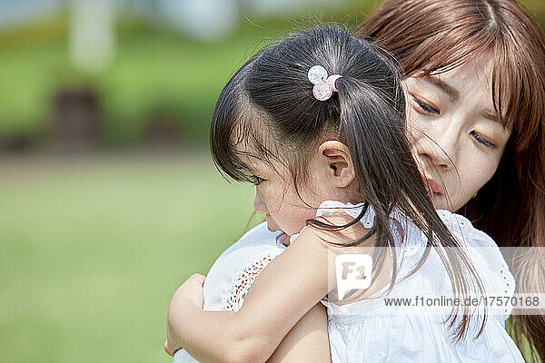 Japanese Girl Hugging Her Mother