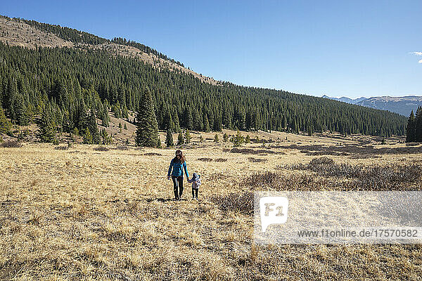 Mother and daughter hiking in the wilderness  Colorado