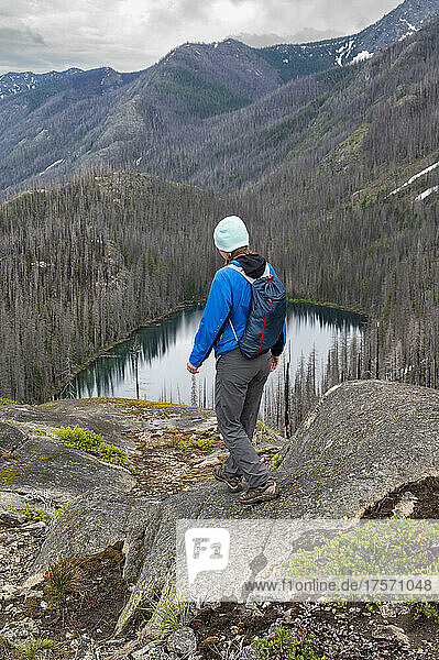 Female hiking above an alpine lake in the Entiat river valley