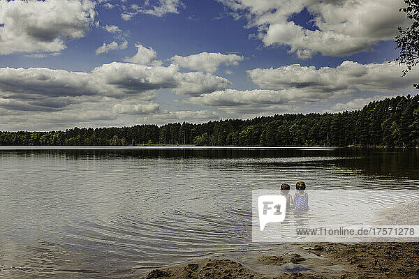 Two girls in lake relaxing