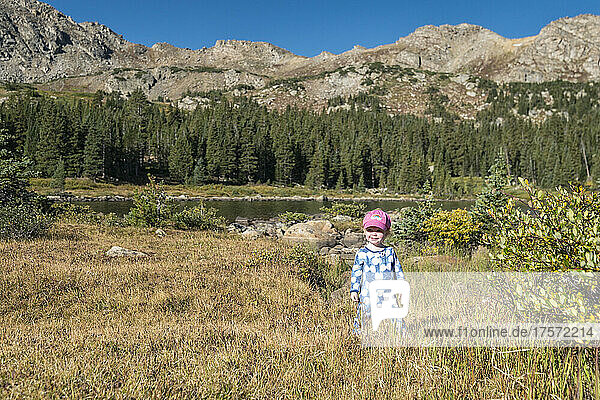 Girl standing at the shore of Windsor Lake  Colorado