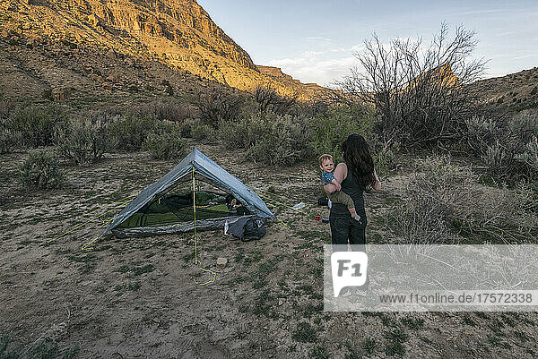 Mother and daughter in the desert camping