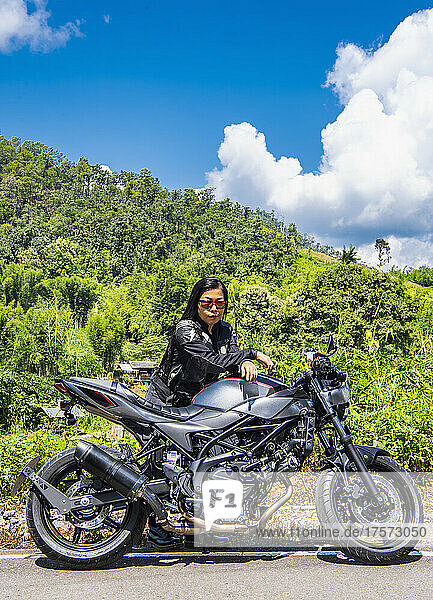 woman on a road trip with her motorbike in the North of Thailand