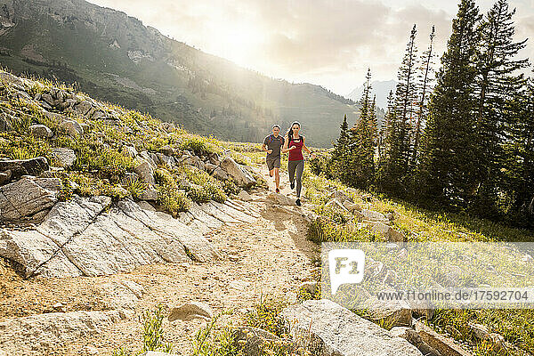 United States  Utah  Alpine  Couple jogging in mountains