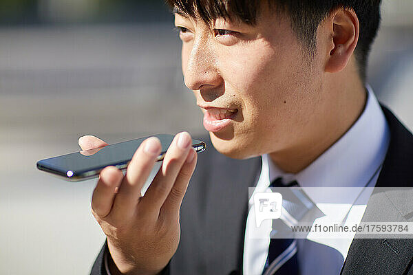 Japanese Businessman Using Phone