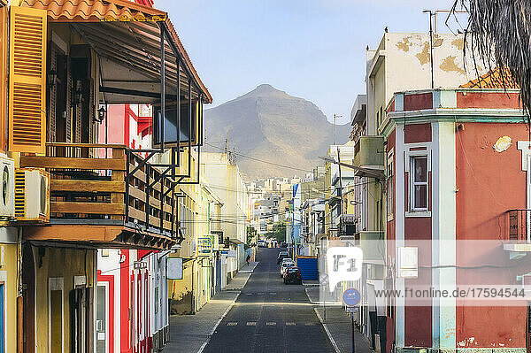 Cape Verde  Sao Vicente  Mindelo  Empty city street with house balcony in foreground and mountain in background