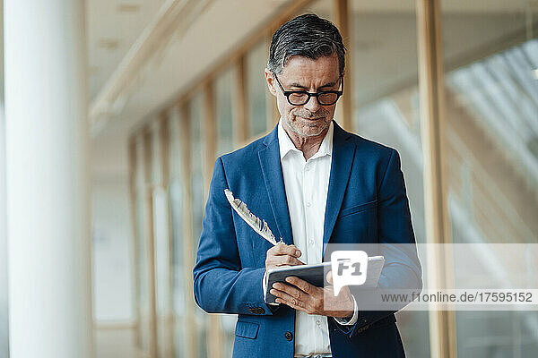 Businessman using tablet PC at office