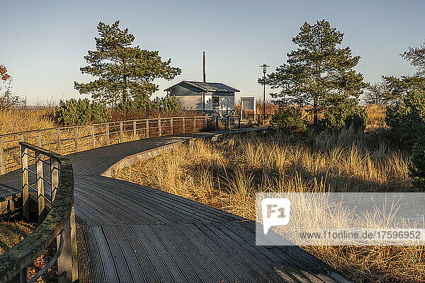 Germany  Schleswig-Holstein  Niendorf  Empty boardwalk at dusk