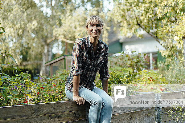 Smiling woman in fresh garden