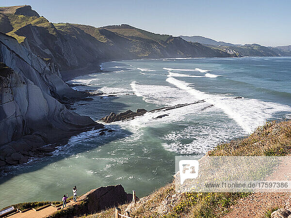 Sea waves rushing towards coastline on sunny day  Basque Coast Geopark  Basque Country  Spain