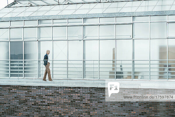 Businesswoman walking on balcony at office
