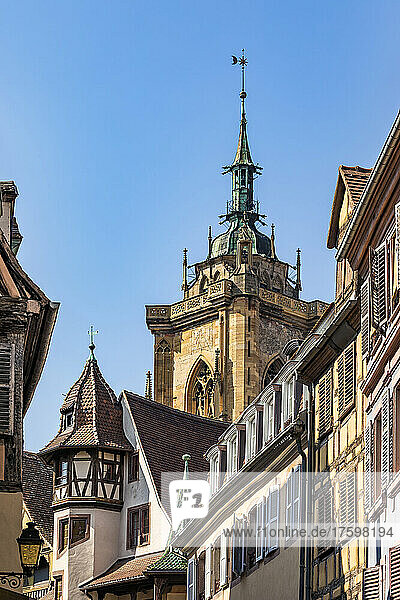 France  Alsace  Colmar  Old town houses with bell tower of Saint Martins Church in background