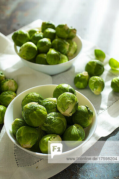 Bowls of raw fresh Brussels sprouts