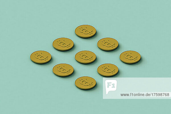 Three dimensional render of Bitcoins flat laid against turquoise background