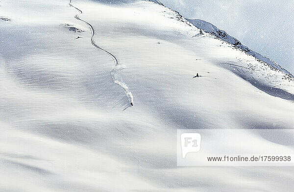 Young man skiing on snow covered mountain  Tyrol  Austria