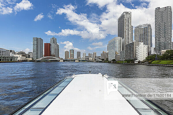 Japan  Kanto Region  Tokyo  Kachidoki Bridge and downtown skyscrapers seen from tourboat sailing along Sumida River