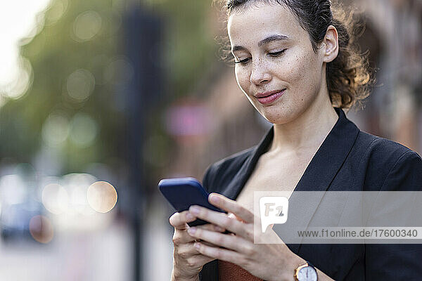 Young businesswoman using smart phone