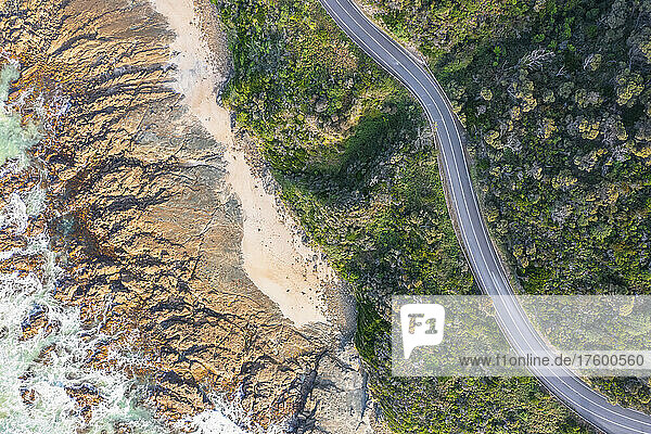 Australia  Victoria  Aerial view of rocky coastline and stretch of Great Ocean Road in summer