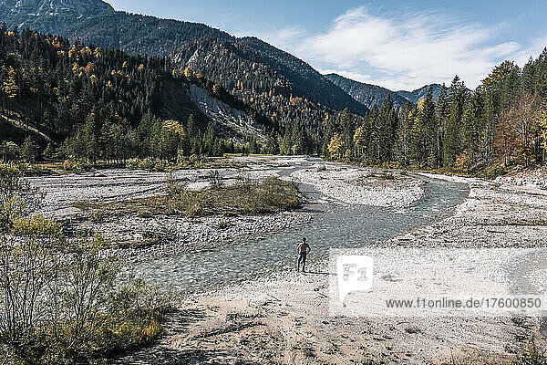Man standing by river Rissbach  Hinterriss  Tirol  Austria