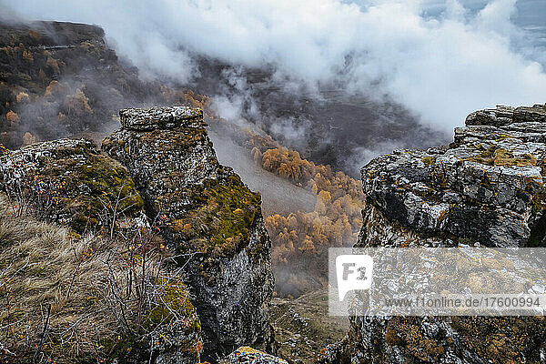 Mountainous landscape of North Caucasus on foggy autumn day