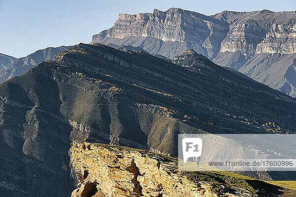 Female hiker admiring landscape of Caucasus Mountains
