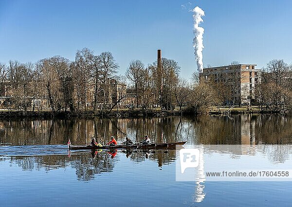 The chimneys of the Vattenfall combined heat and power plant  rowing boat  Havel in Spandau  Berlin  Germany  Europe