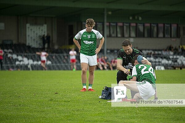 Gaelic football player hurt during a competitive match  and rests on the grass during a Gaelic football competition in Sligo  Sligo  Ireland  Europe