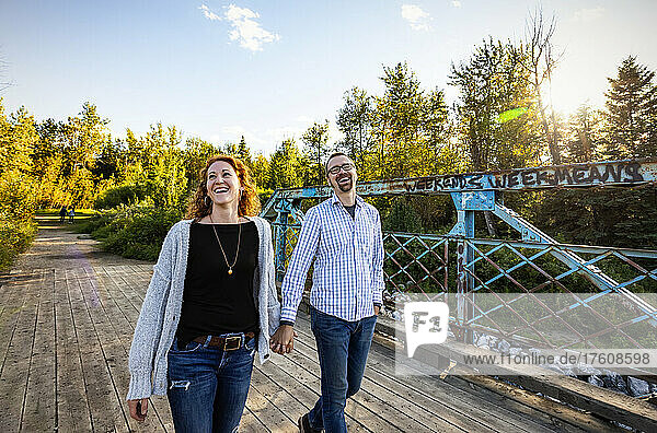 Mature married couple enjoying time together outdoors in a park in autumn; Edmonton  Alberta  Canada