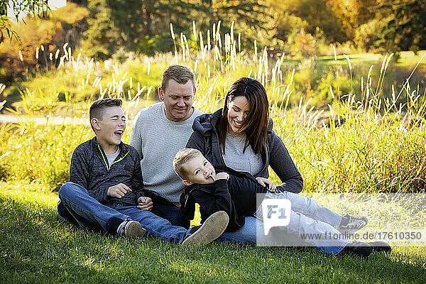 Portrait of a family with two boys in a park in autumn; St. Albert  Alberta  Canada