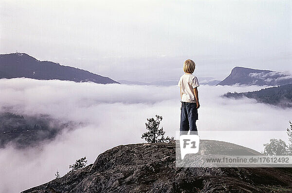 Boy Standing on Mountaintop Salt Spring Island  B.C.  Canada