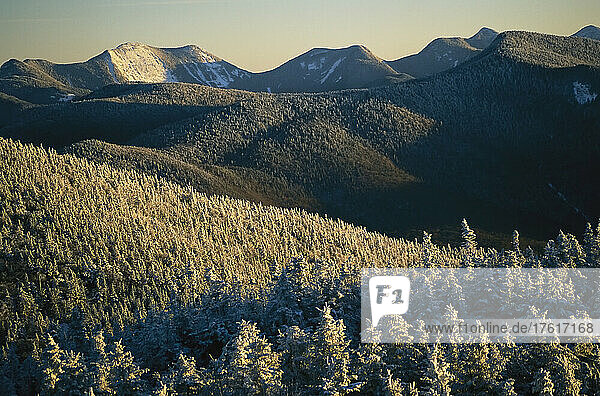 Snow covers trees and hills in the Adirondack Mountain region.; Adirondack Mountains  New York.